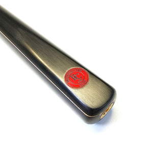 Close-up of Premium Cues ICON No.006 butt with red logo badge and brass insert, showcasing craftsmanship in one piece snooker cue design.