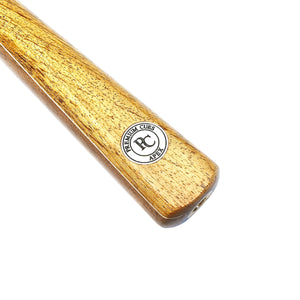 Close-up of the Premium Cues Apex Handmade 8 Ball Pool Cue butt showcasing the engraved PC Apex logo on the polished Ovangkol wood.