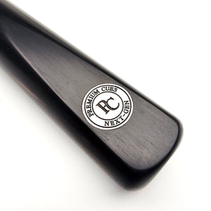 Close-up of Premium Cues Next-Gen 52" Junior Snooker Cue butt with PC logo, showcasing brand authenticity and sleek black finish.