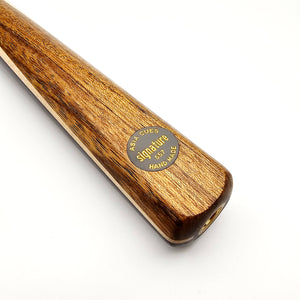 Close-up of Asia Cues Signature No.557 cue butt showcasing handmade label and polished wood grain finish.