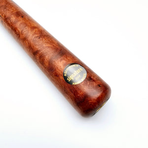 Close-up of Asia Cues Signature No.227 pool cue butt featuring burl wood finish and engraved handmade label for premium cue design.