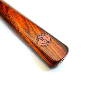 Close-up of Premium Cues ICON No.013 butt showcasing Cocobolo wood grain, ICON logo, and threaded extension fitting for snooker cue control.