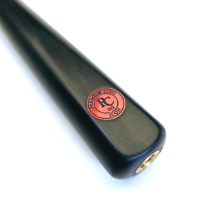 Close-up of Premium Cues ICON No.012 snooker cue butt with red logo badge and threaded extension fitting for cue accessories.