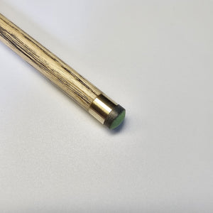 Close-up of Premium Cues ICON No.010 cue tip with brass ferrule and green tip, optimized for spin and precision in snooker.
