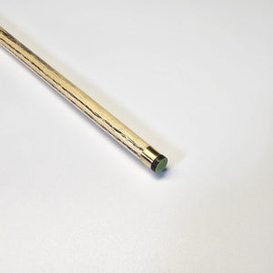 Tip close-up of Premium Cues ICON No.001 - One Piece Pool Cue with green cue tip and brass ferrule for enhanced shot control.