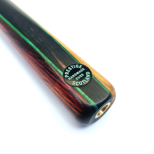 Close-up of Prestige Cues Green Plate cue butt featuring handmade Scotland badge and green veneer between Cocobolo and ebony wood.
