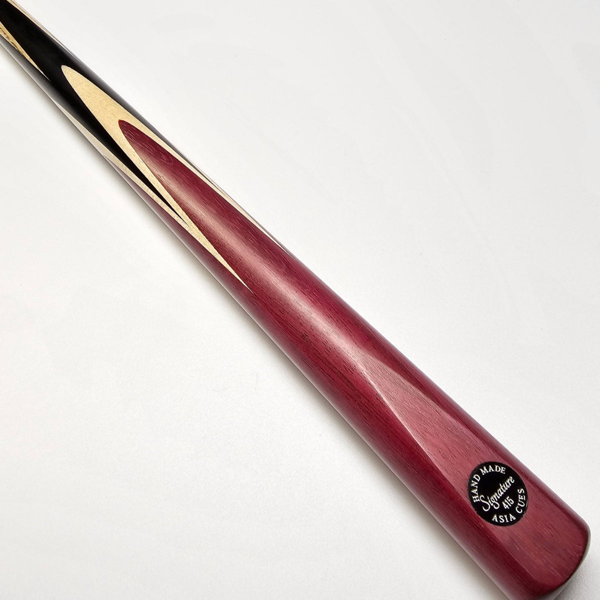 Asia Cues Signature One Piece Snooker Cue  Handmade Ebony Butt with 4 lower splices of Purple Heart and 4 veneers of Thick Birdseye Maple. Butt View