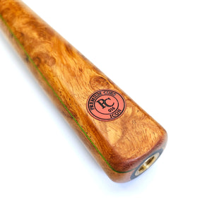 Close-up of Premium Cues ICON No.016 snooker cue butt featuring Amboyna Burl wood, green veneer detailing, and RC ICON 016 logo.