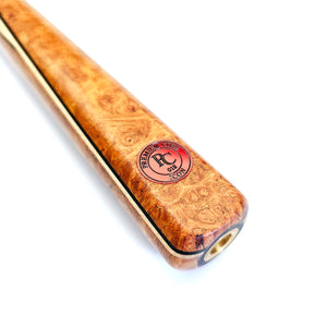 Close-up of Premium Cues ICON No.018 snooker cue butt featuring Amboyna Burl wood, birdseye maple veneers, and red ICON authenticity badge.