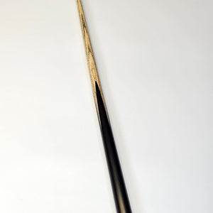 Full-length angled view of Premium Cues ICON No.009 snooker cue showing smooth transition from ebony butt to ash shaft.