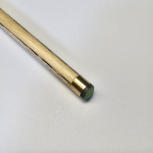 Close-up of Premium Cues ICON No.006 cue tip with brass ferrule and green tip, optimized for control and spin in snooker play.