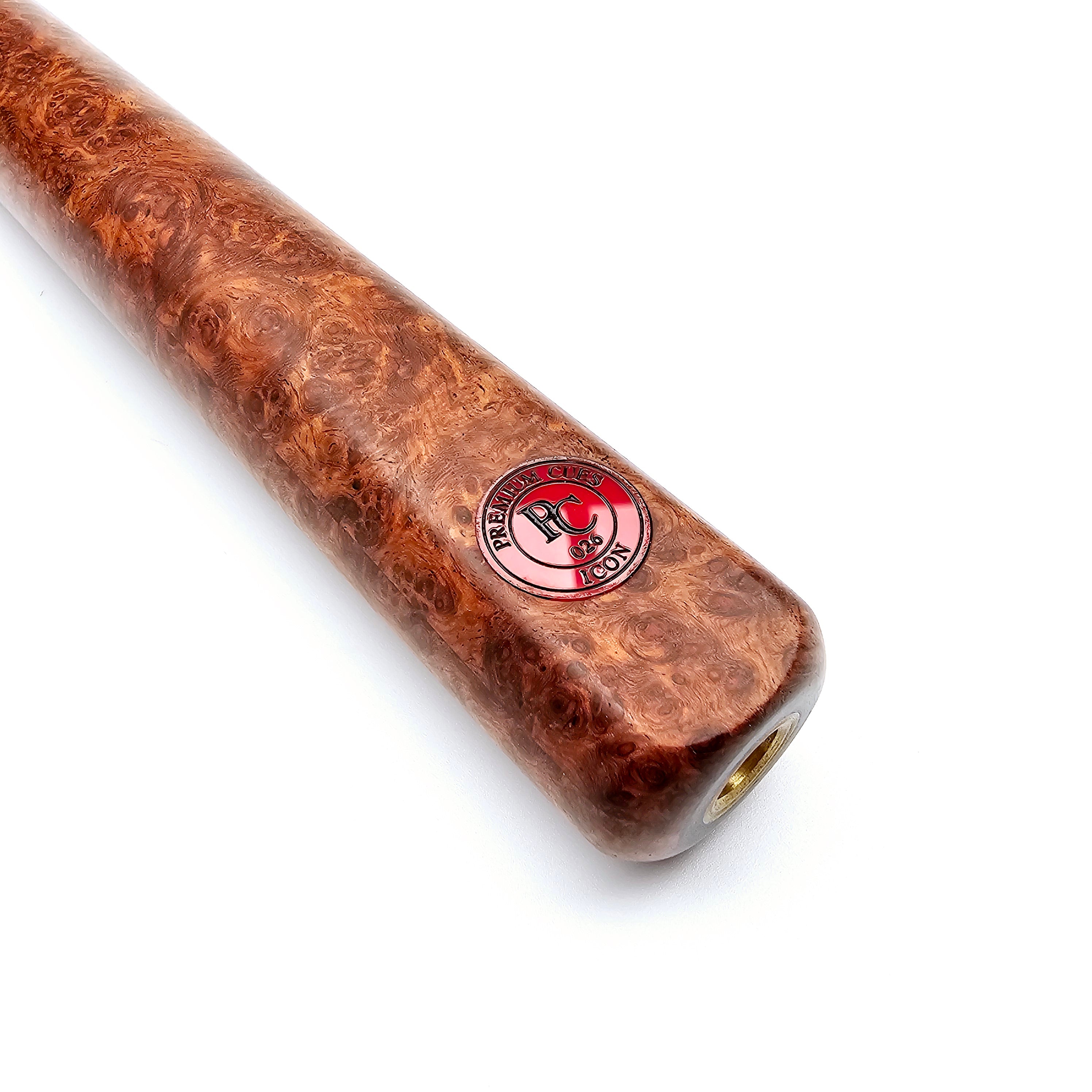 Close-up of Premium Cues ICON No.026 cue butt featuring burlwood texture and red logo badge, ideal for professional snooker players.