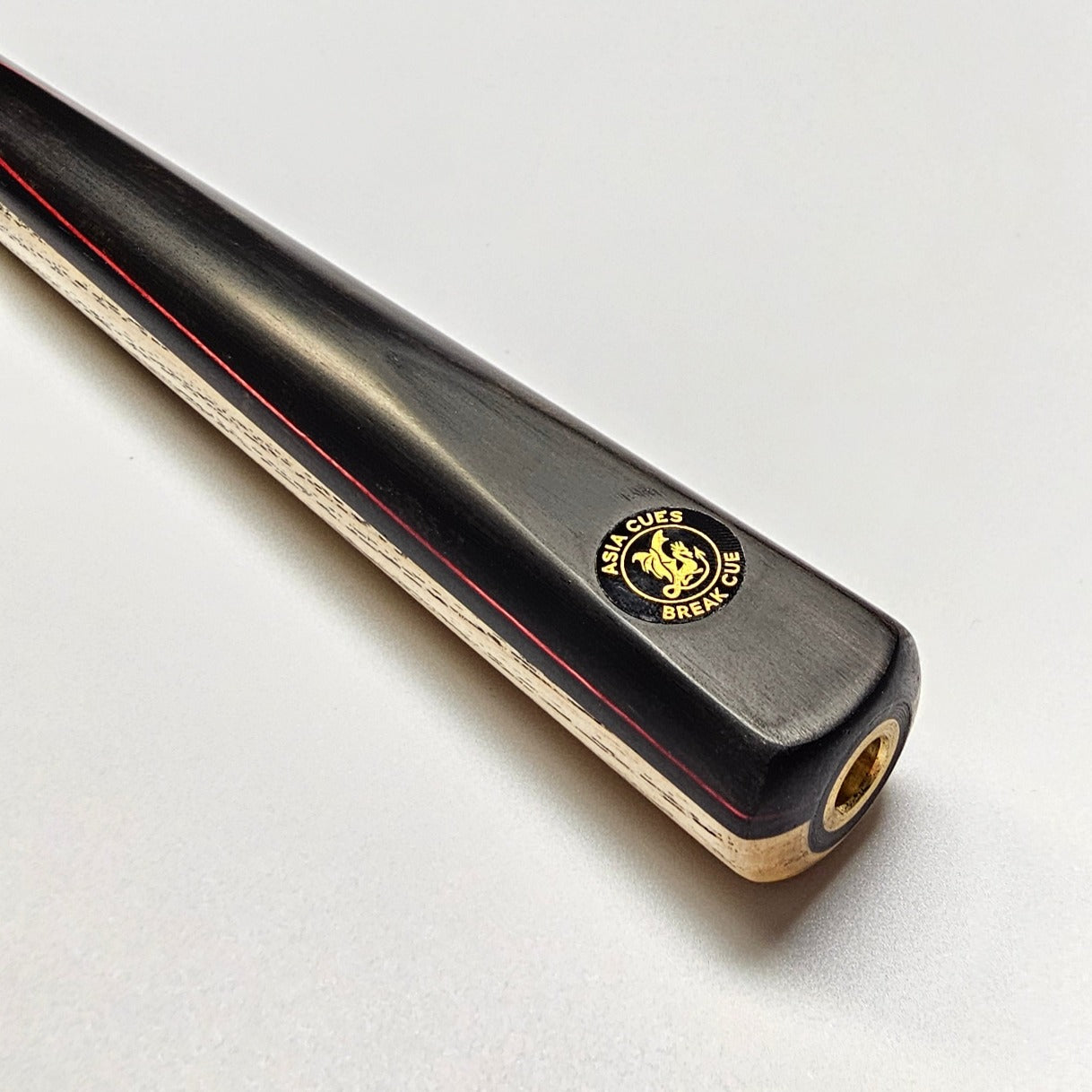 Asia Cues 3/4 Jointed Ash Ebony with Red Veneer badge view